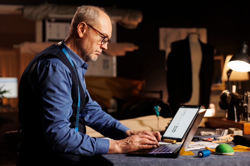 Top 7 Reasons Why Small Businesses Are Losing Traffic - elderly experienced couturier typing measurements laptop professional atelier shop workspace skilled expert fashion designer searching online sartorial inspiration elderly experienced couturier typing measurements laptop professional atelier shop workspace skilled expert fashion designer searching online sartorial inspiration